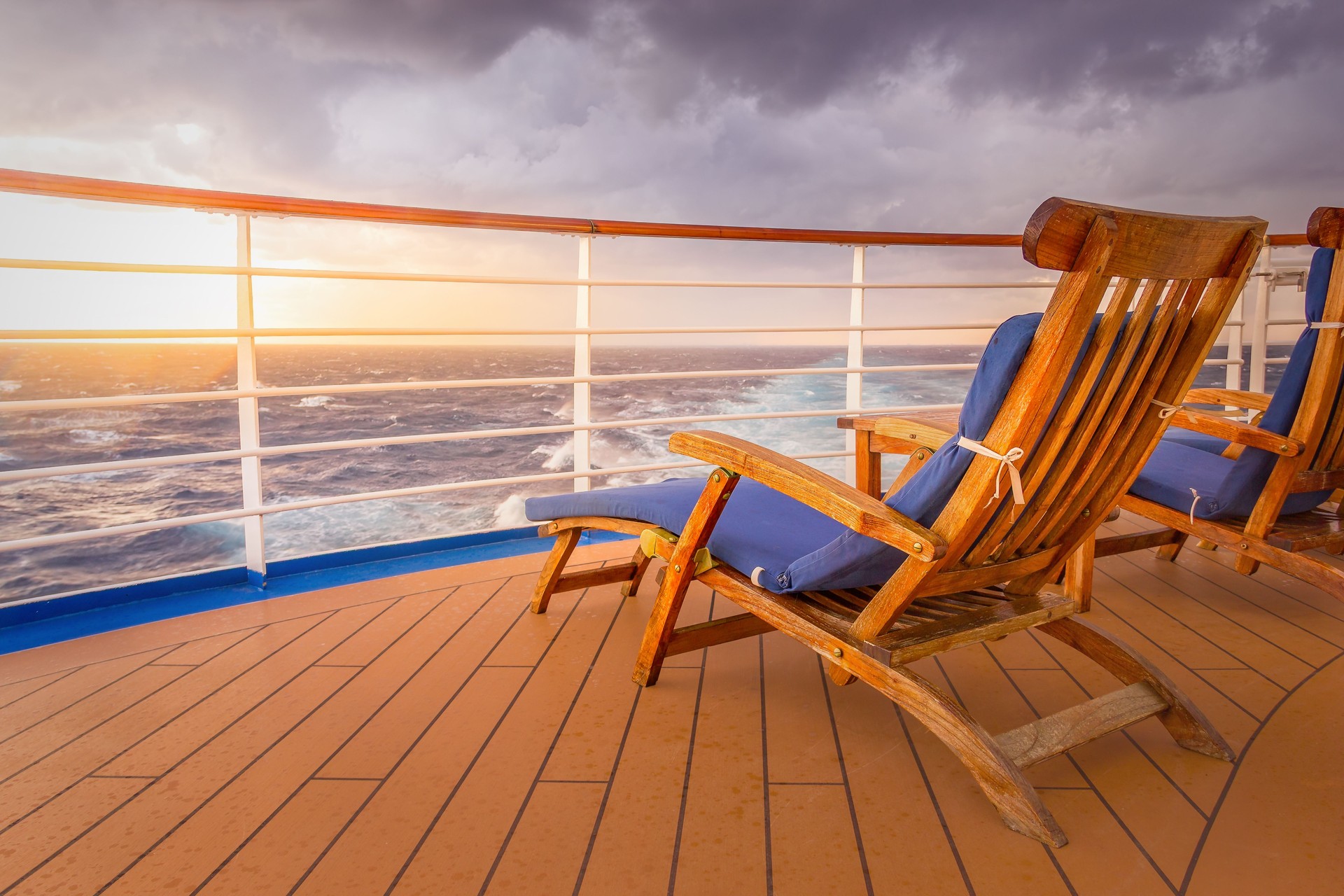 Luxury Cruise Ship Deck with Lounge Seating and Ocean Backdrop